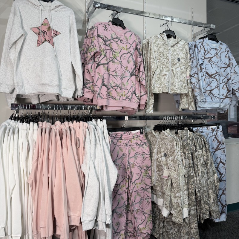 Image of camo clothing hanging on a wall